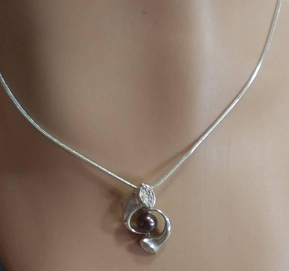 silver necklace and pendant